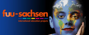 logo fuu-sachsen internatonal and portrait of a boy with world map as face painting