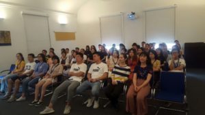 Group of students from Chongqing / China is sitting in the welcome room of the Nudelcenter Riesa